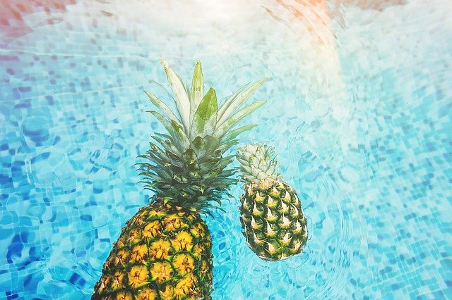 Pineapple floating in fresh water