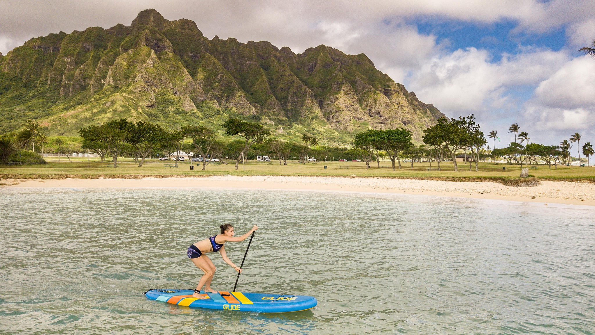 woman paddling an inflatable paddle board