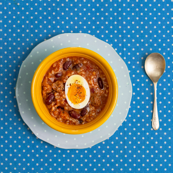 A slow cooker with a low carb soup cooking inside