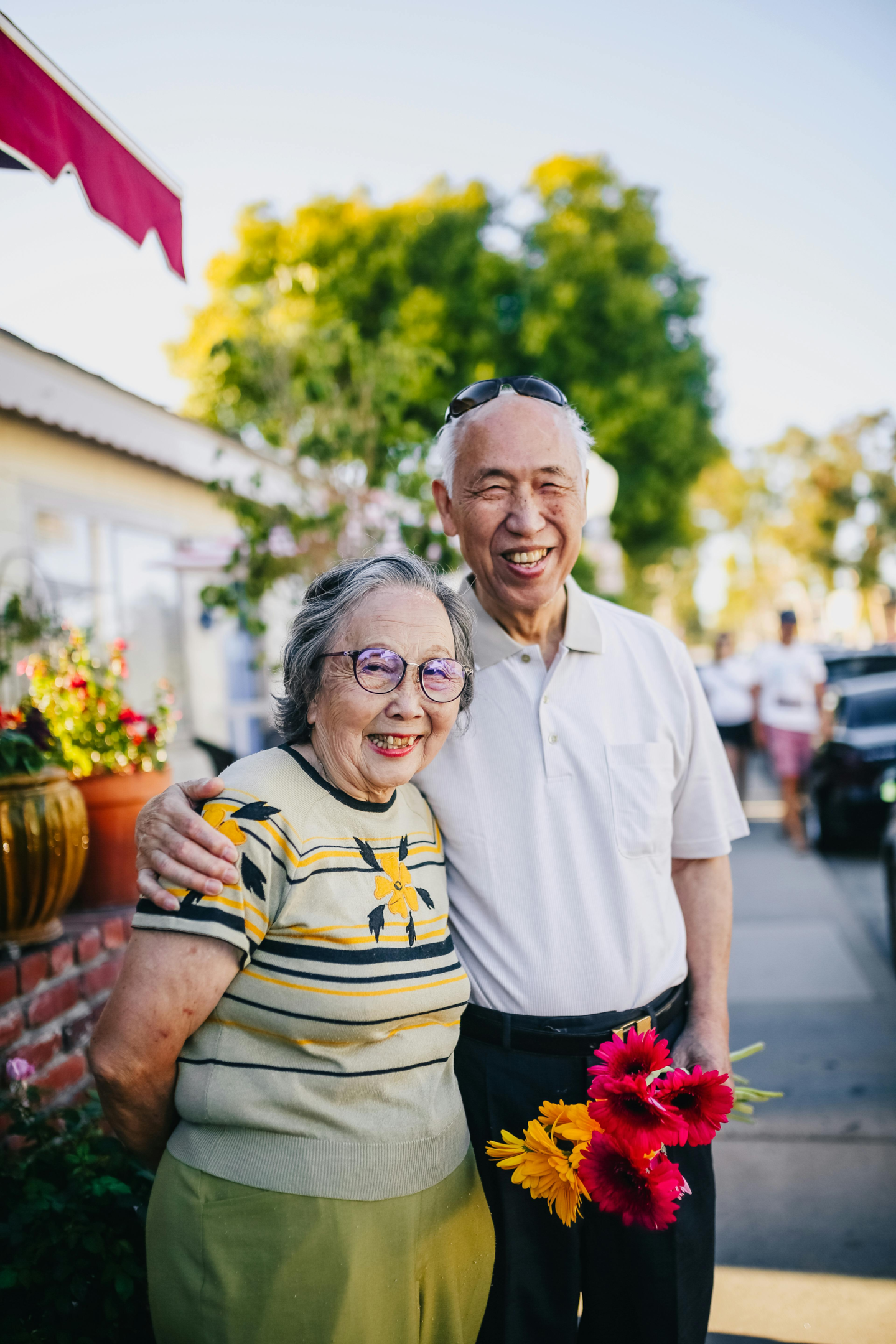Photo of an older couple that are replacing missing teeth with dental services like dental implants