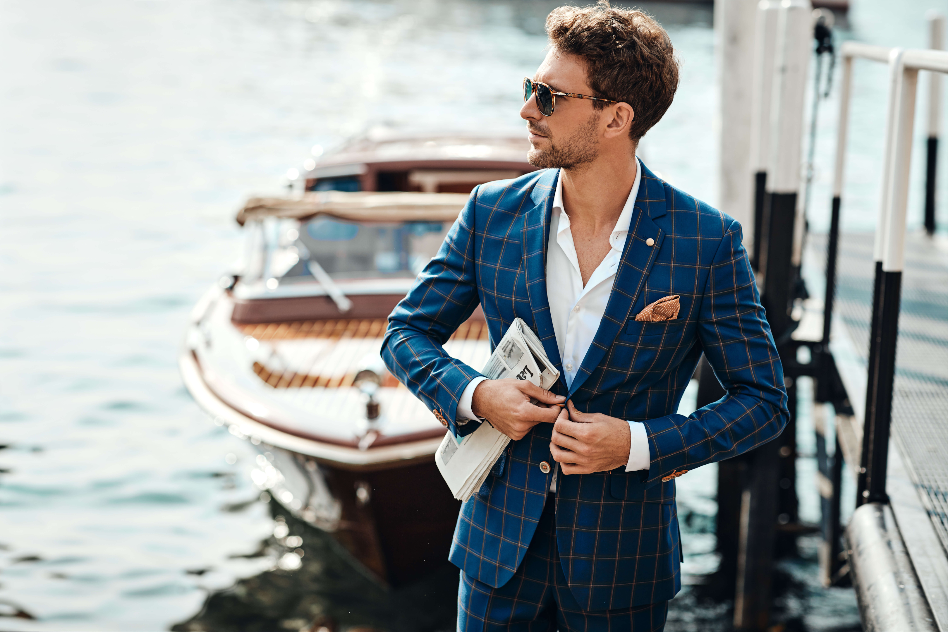 Wearing check patterned suits and sunglasses.