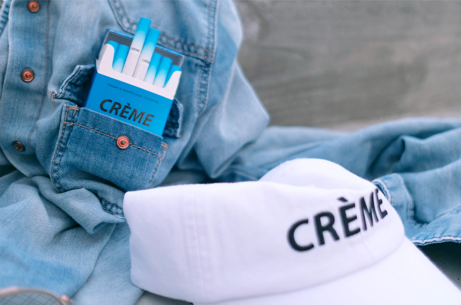 creme cbd cigarettes, white hat, denim jacket