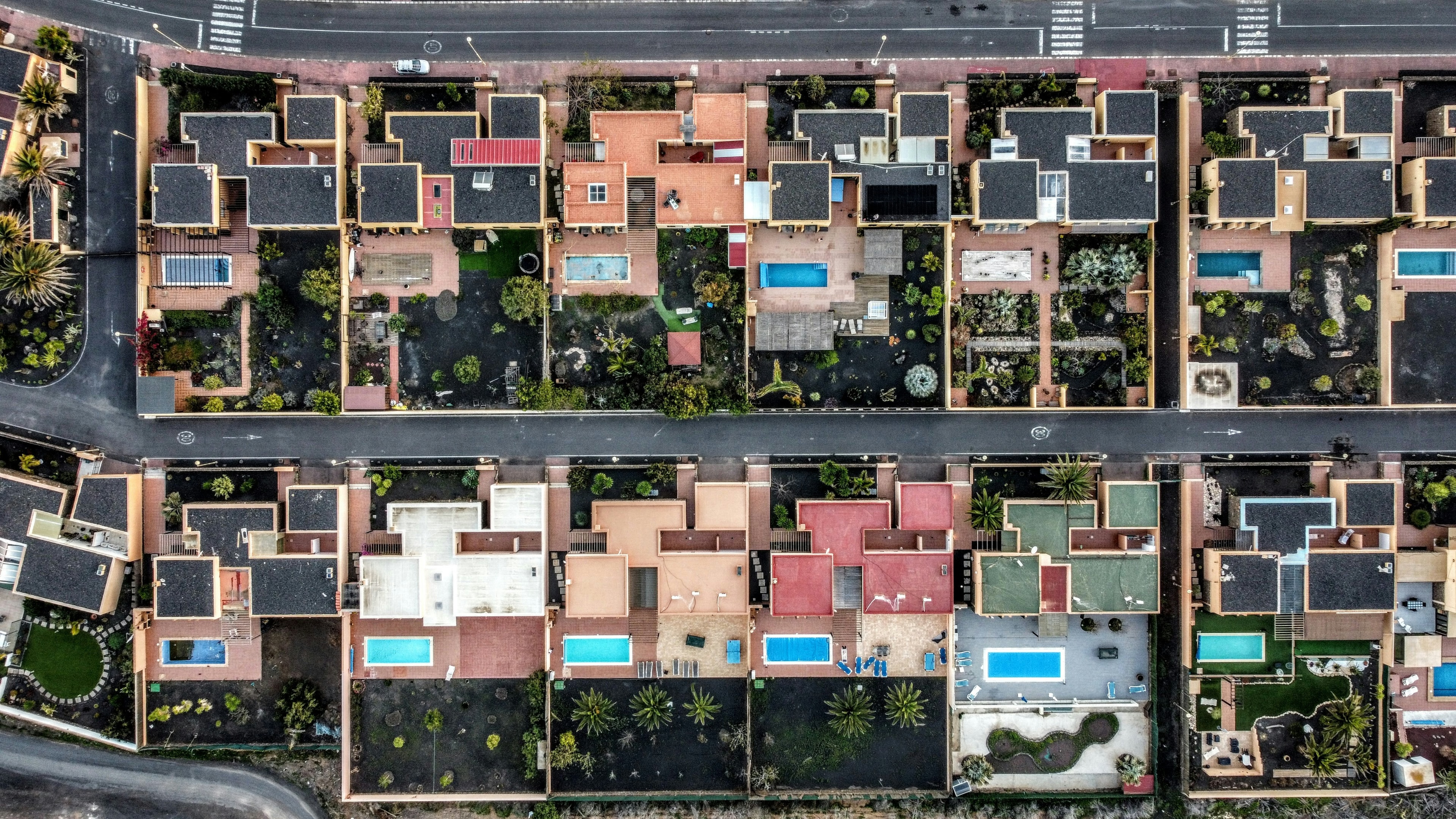 Aerial view of suburban neighborhood used by real estate investor when evaluating for rental property possibilities.