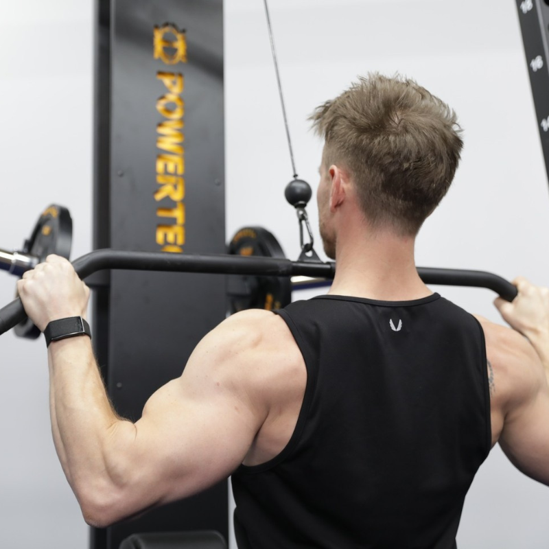 Image showing the correct form for a wide-grip lat pulldown.