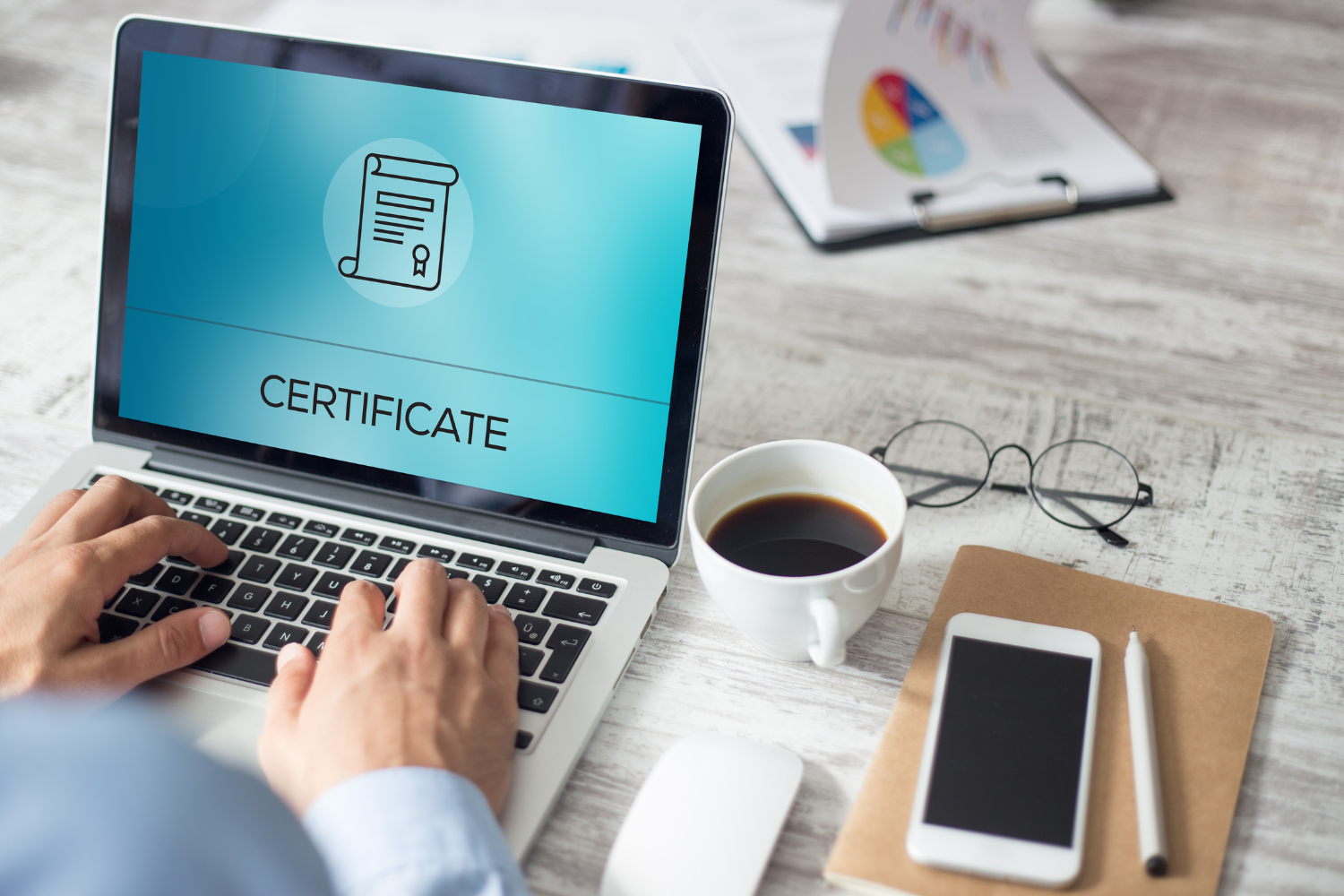 Person completing an online certification on his laptop.