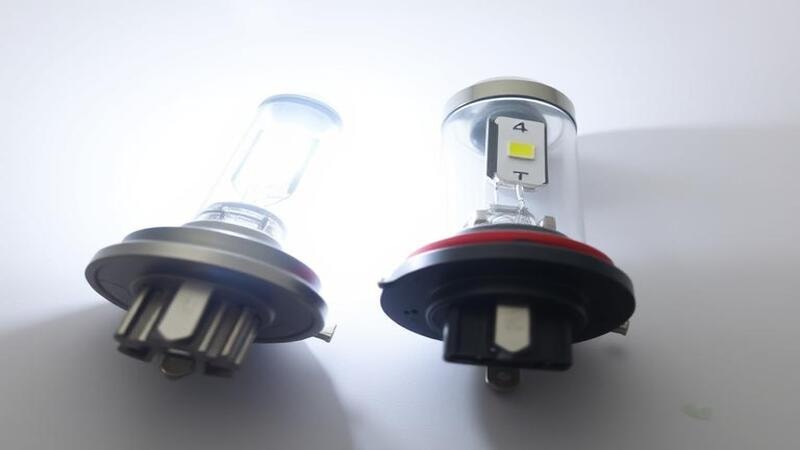 H4 LED headlight bulb compared with halogen bulb side-by-side.