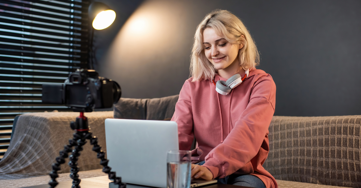 OnlyFans creator reviewing reports from her trusted tax and bookkeeping services at home.