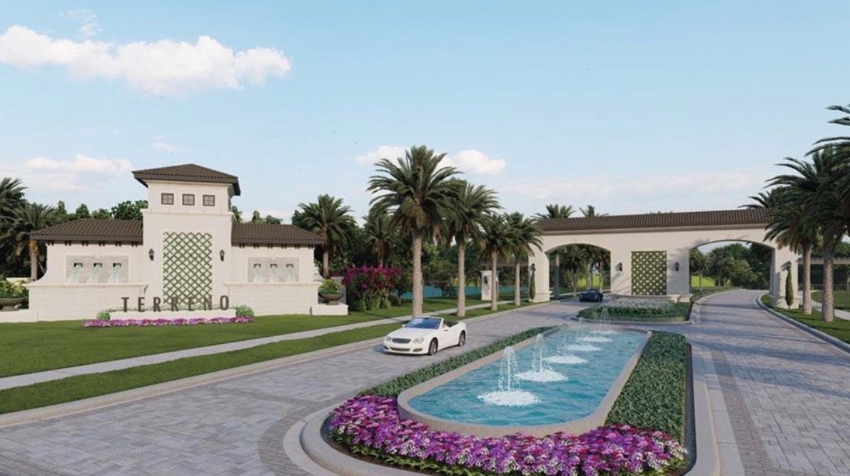 The image showcases scenic views of a golf course from the home sites at Terreno at Valencia, highlighting lush fairways and serene water features that enhance the beauty of this luxurious community. The picturesque setting reflects the resort lifestyle and private amenities available to residents in Naples, FL.