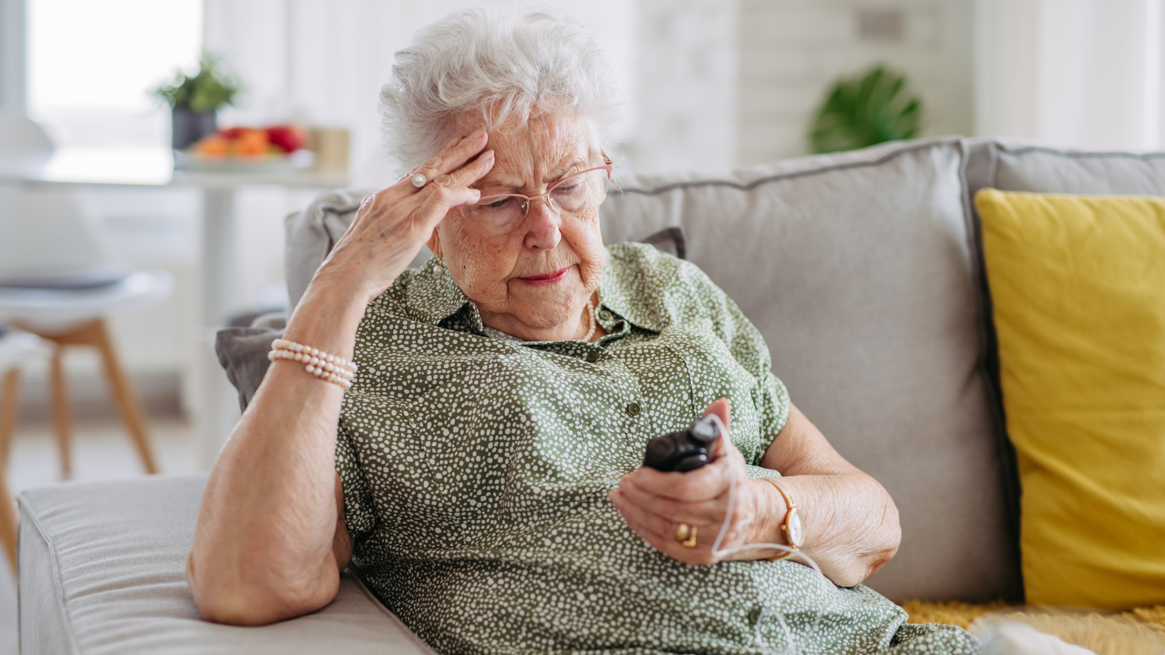 senior woman setts up blood glucose meter device