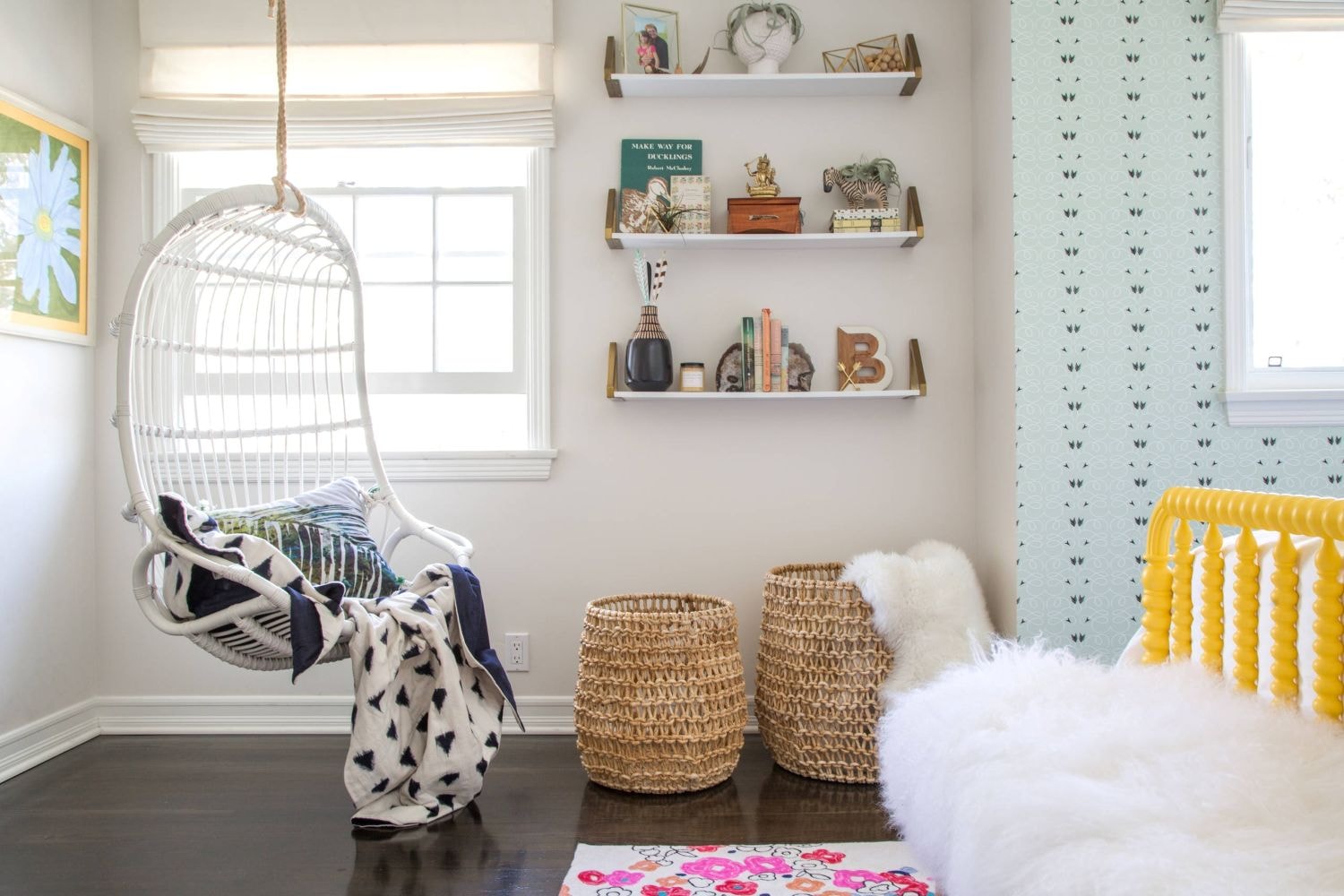 teenage bedroom with hanging chair near a window