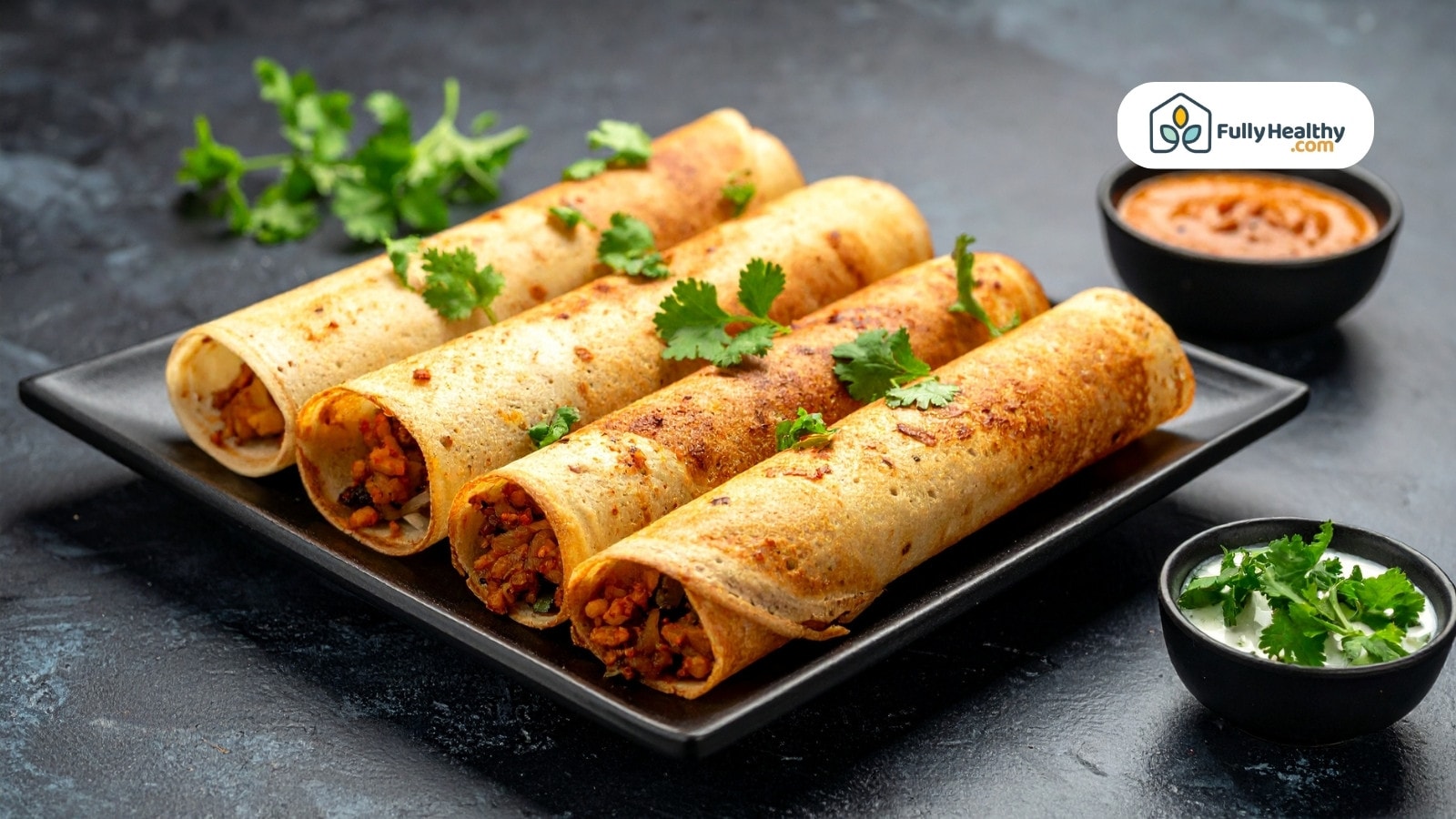 Stuffed crispy rolls on plate garnished with fresh coriander leaves