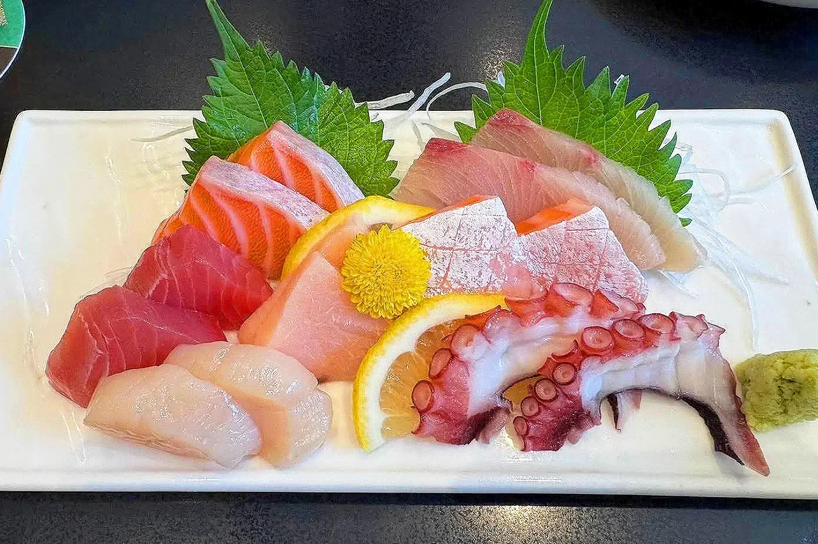 Standing Sushi Bar Singapore fresh sashimi platter featuring salmon, tuna, white fish and octopus