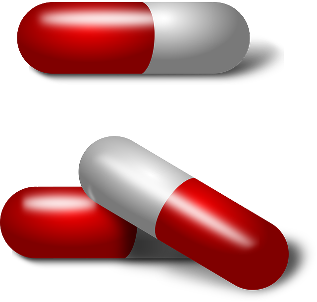 A graphical image of three red and silver colored antibiotic capsules. 