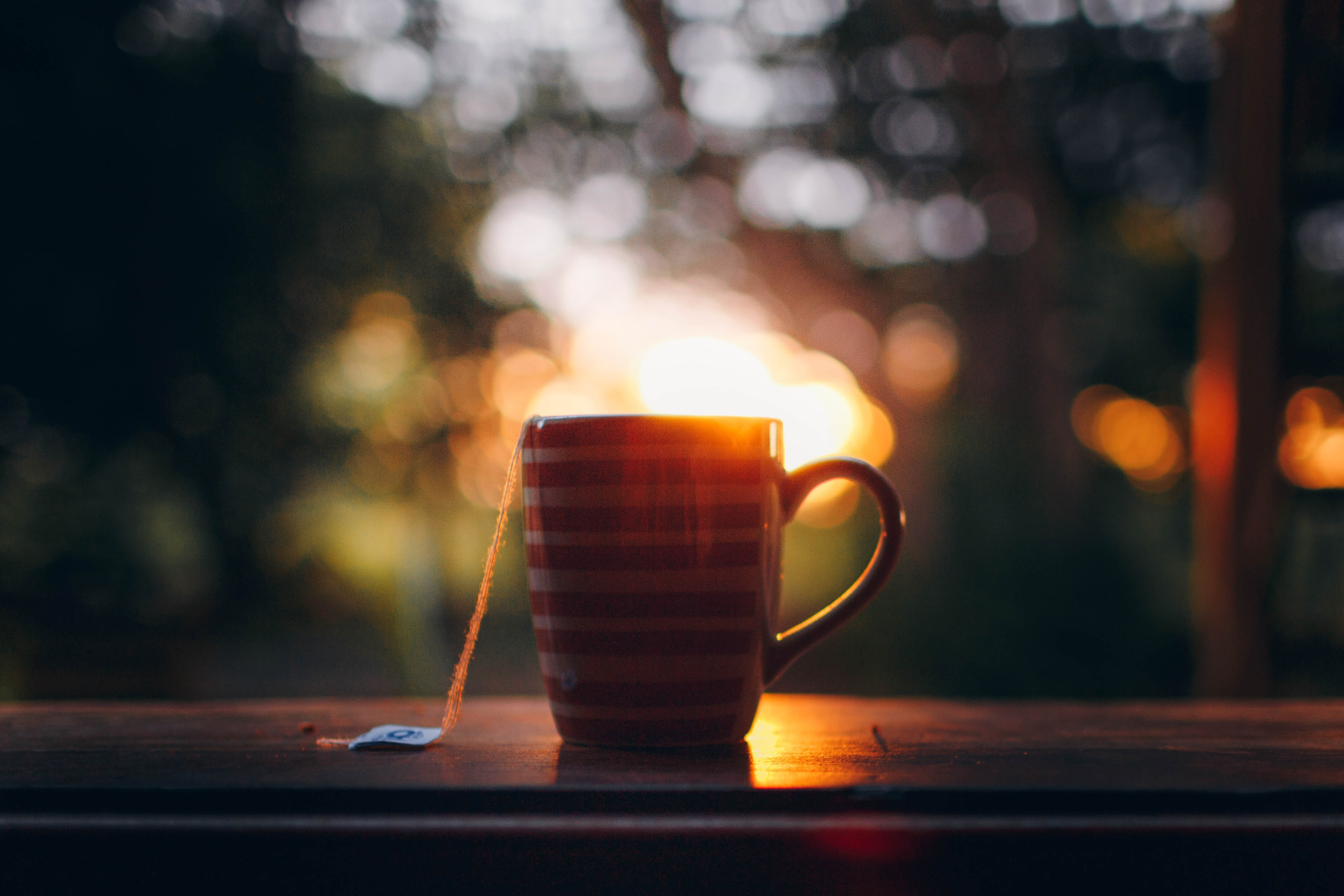 warm cup of tea at sunset