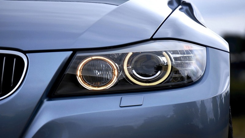 Operating headlights of a car. 