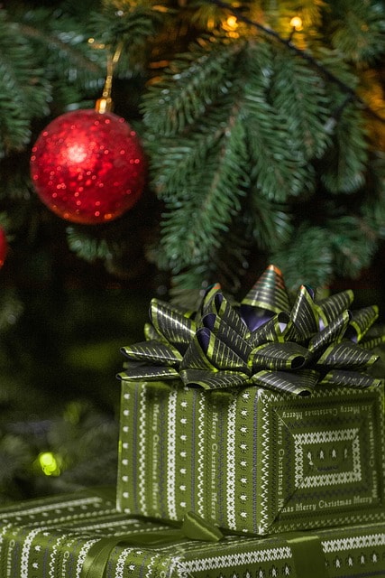 christmas, gift, holiday, present sitting under the tree is a sure bet to make mom happy, get her a light scarf she can wear