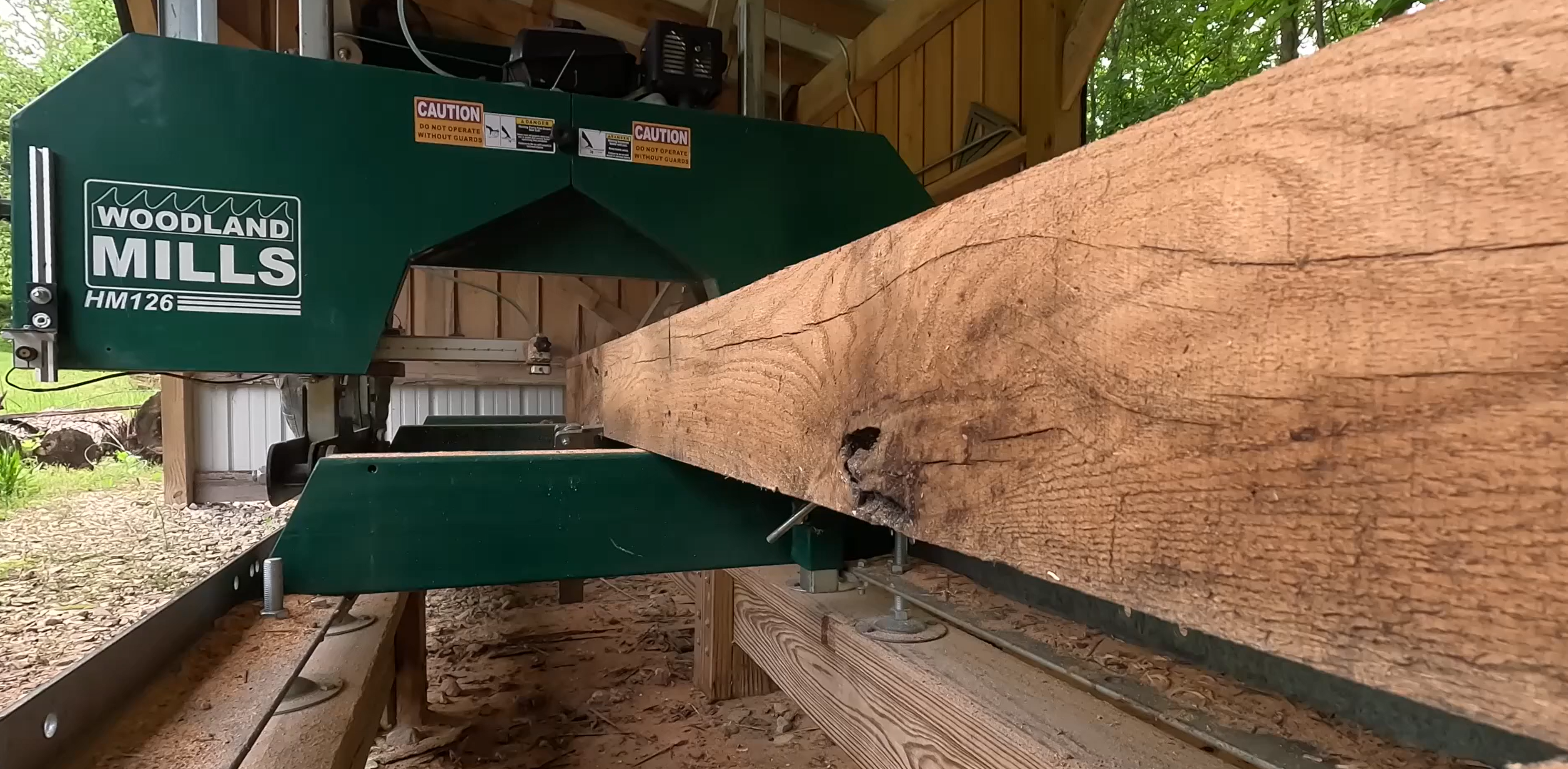 Tony's HM126 portable sawmill, being used to achieve optimal board thickness. 