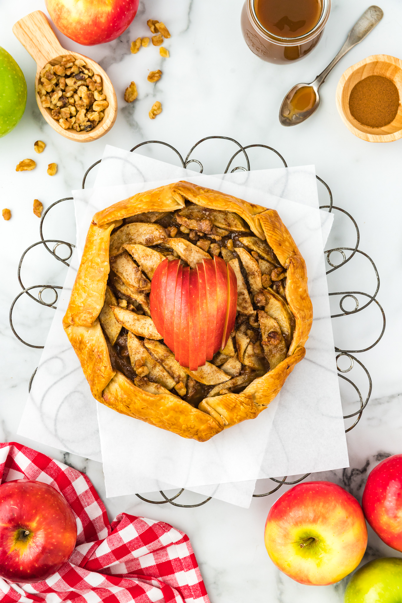 apple crostata topped with an apple in the shape of a heart