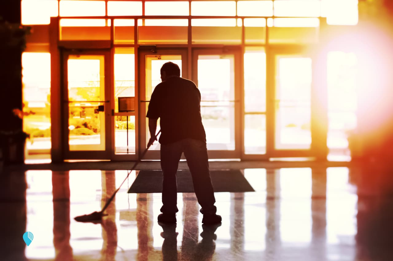 a janitor doing janitorial services in a customer's building