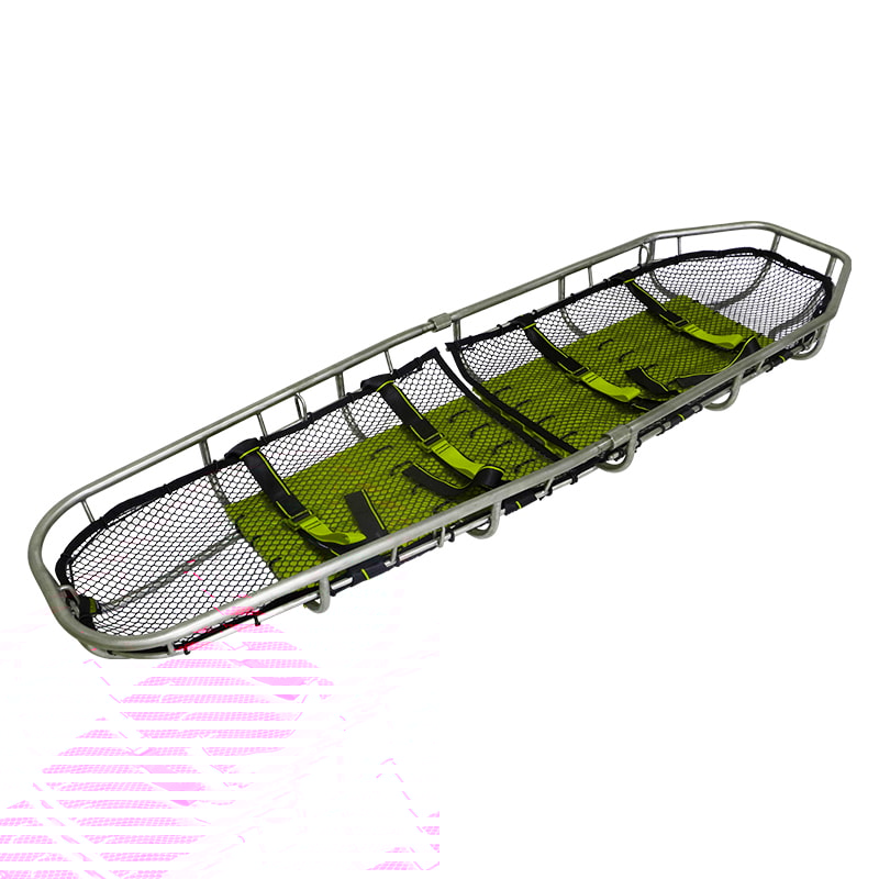 A carbon alloy basket stretcher showcased in a rugged environment.