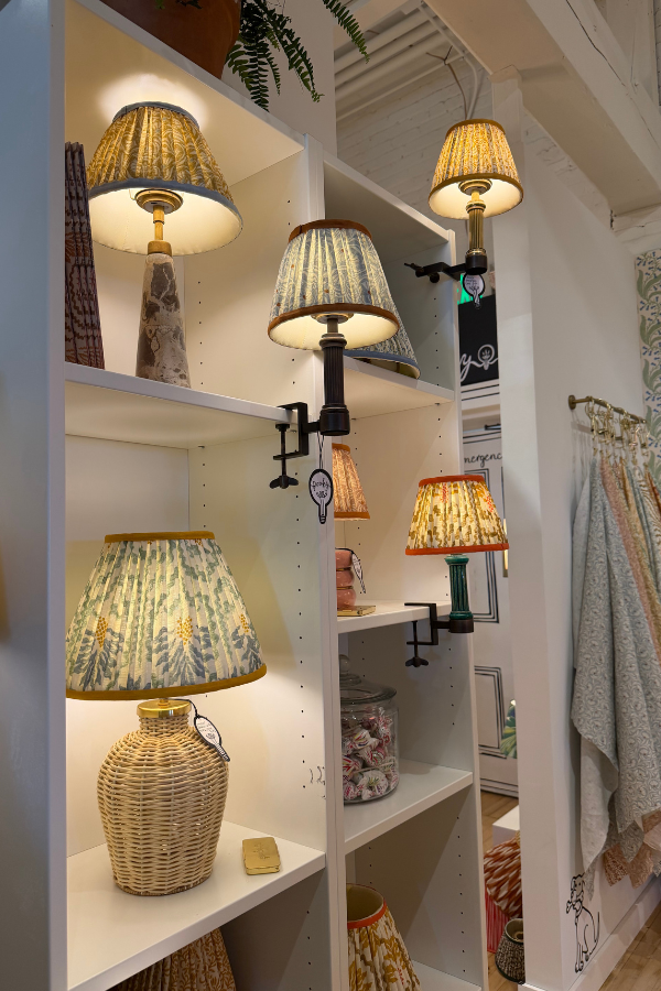 the Pooky showroom with table lamps; you can see the difference in how they create these acorss the show room