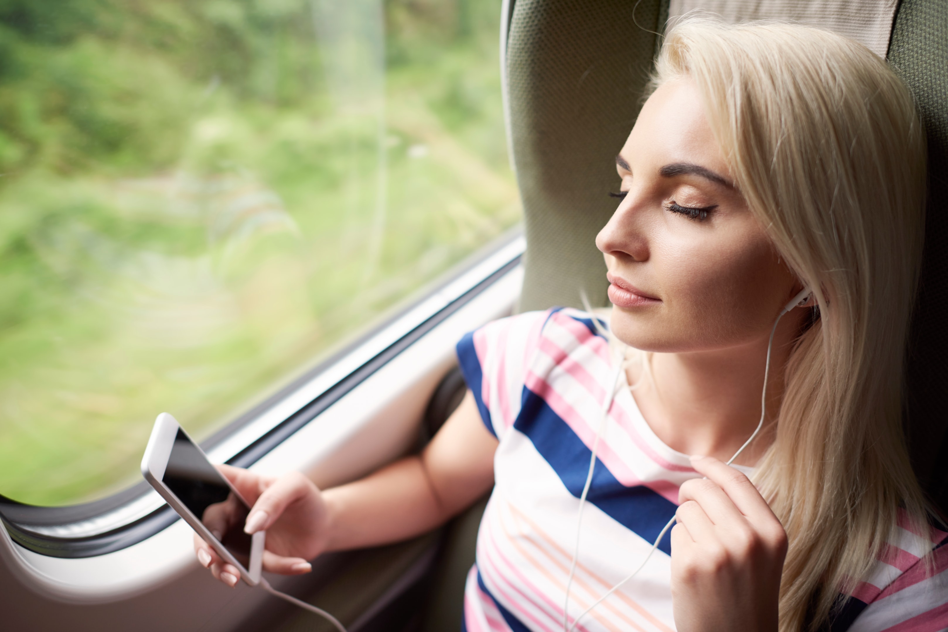a woman listening to music inside the car