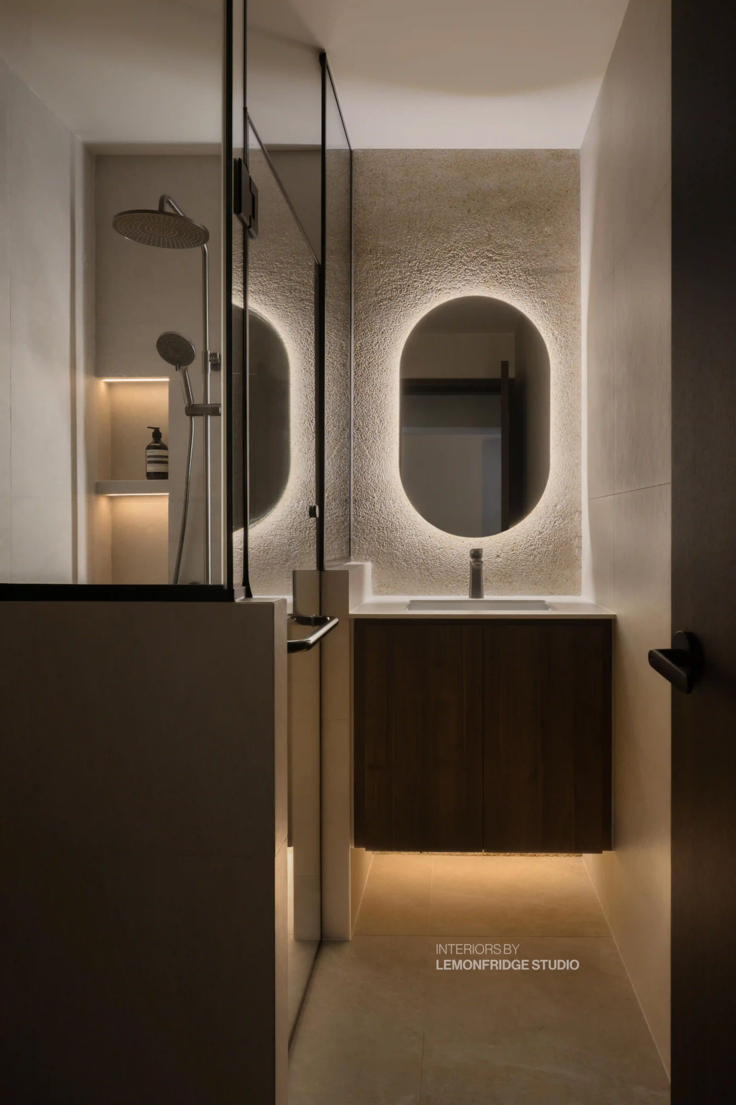 Smart home bathroom in Singapore with occupancy-sensing back-lit mirror and rainfall shower for spa-like ambience