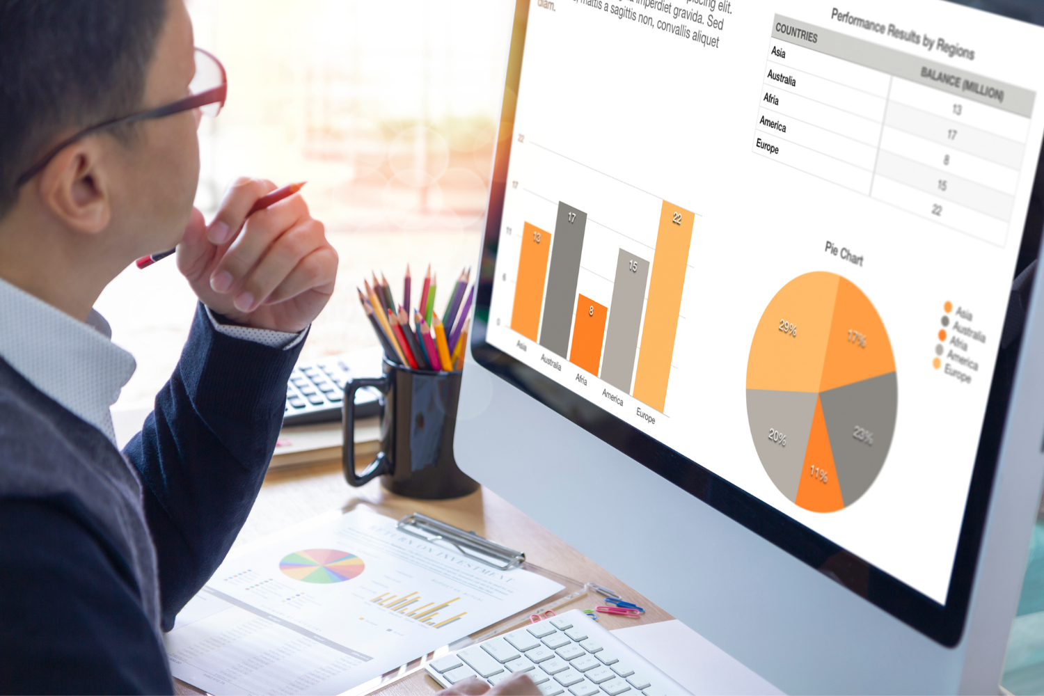Business professional reviewing a performance chart.