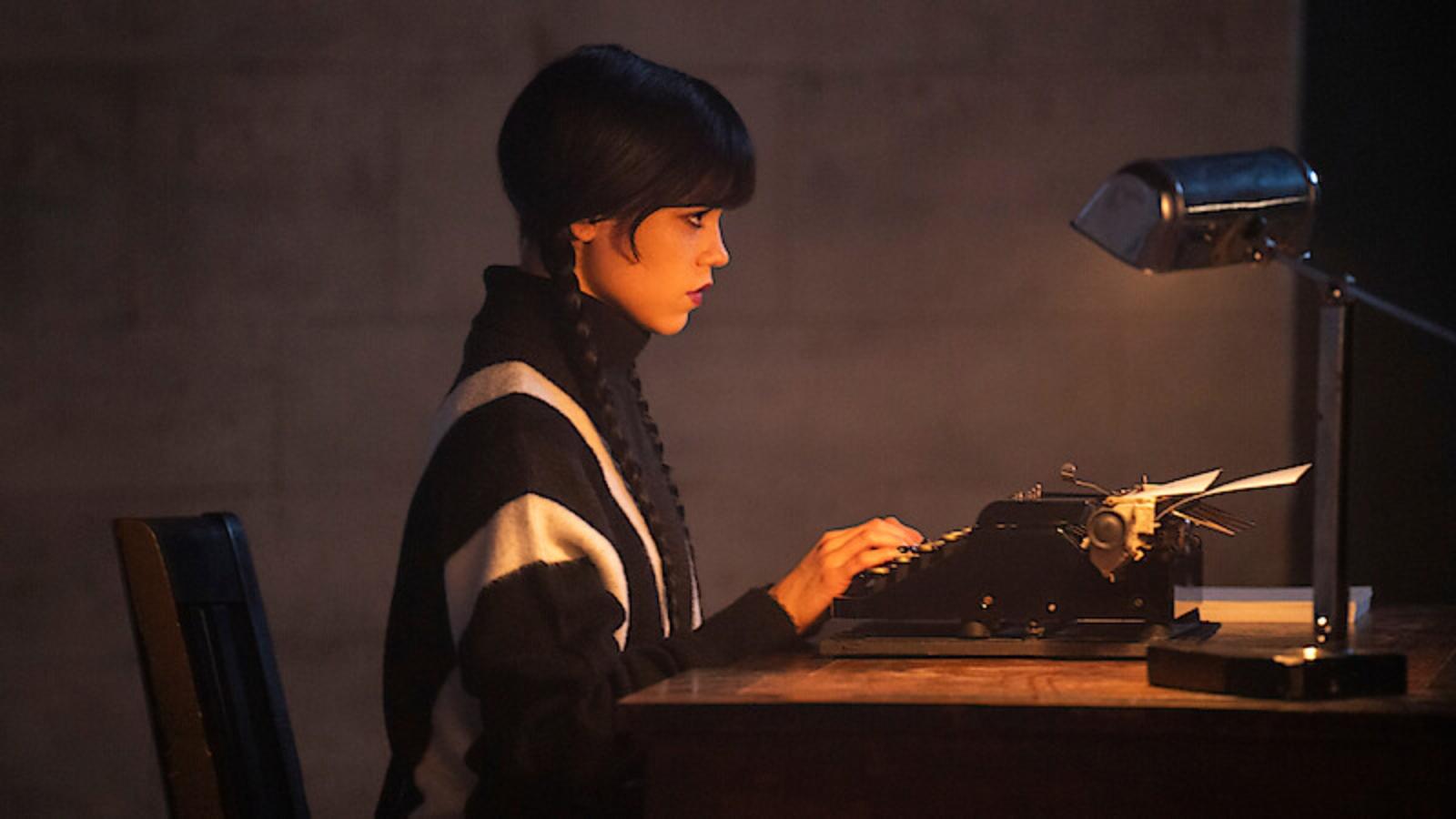 Jenna Ortega as Wednesday Addams typing on typewriter in Wednesday season 3