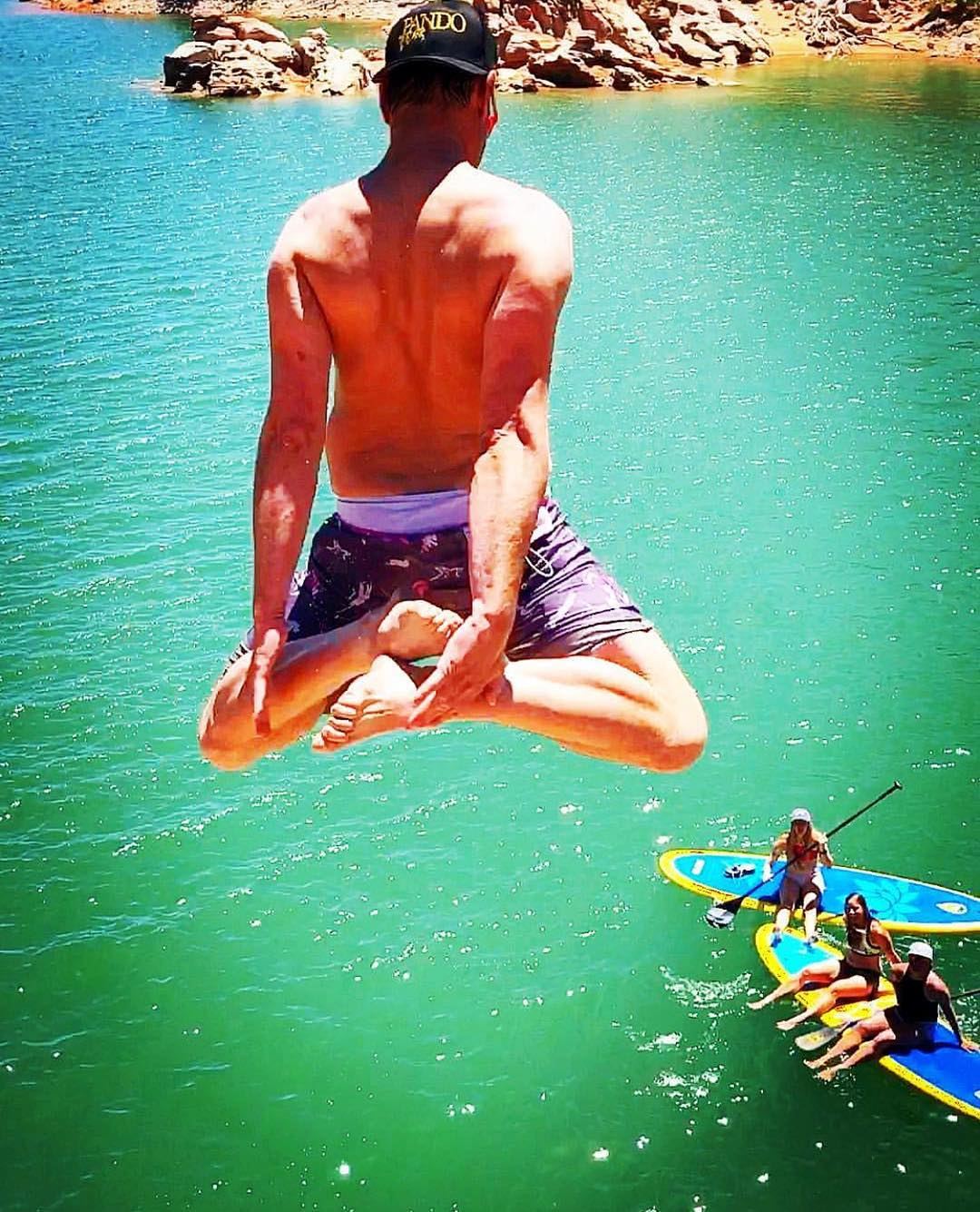 jumping to a paddle board