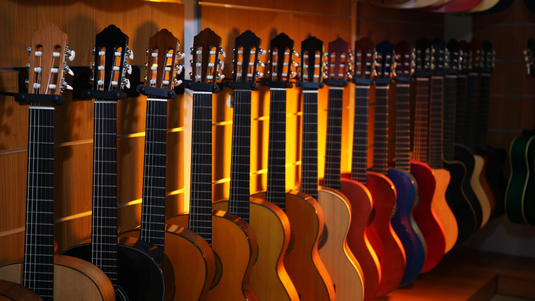 Get the right guitar - acoustic guitars standing on guitar stand with no guitar strap