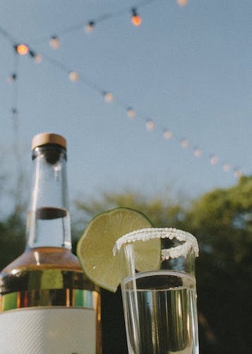 Tequila shots under bistro lights in an inviting atmosphere