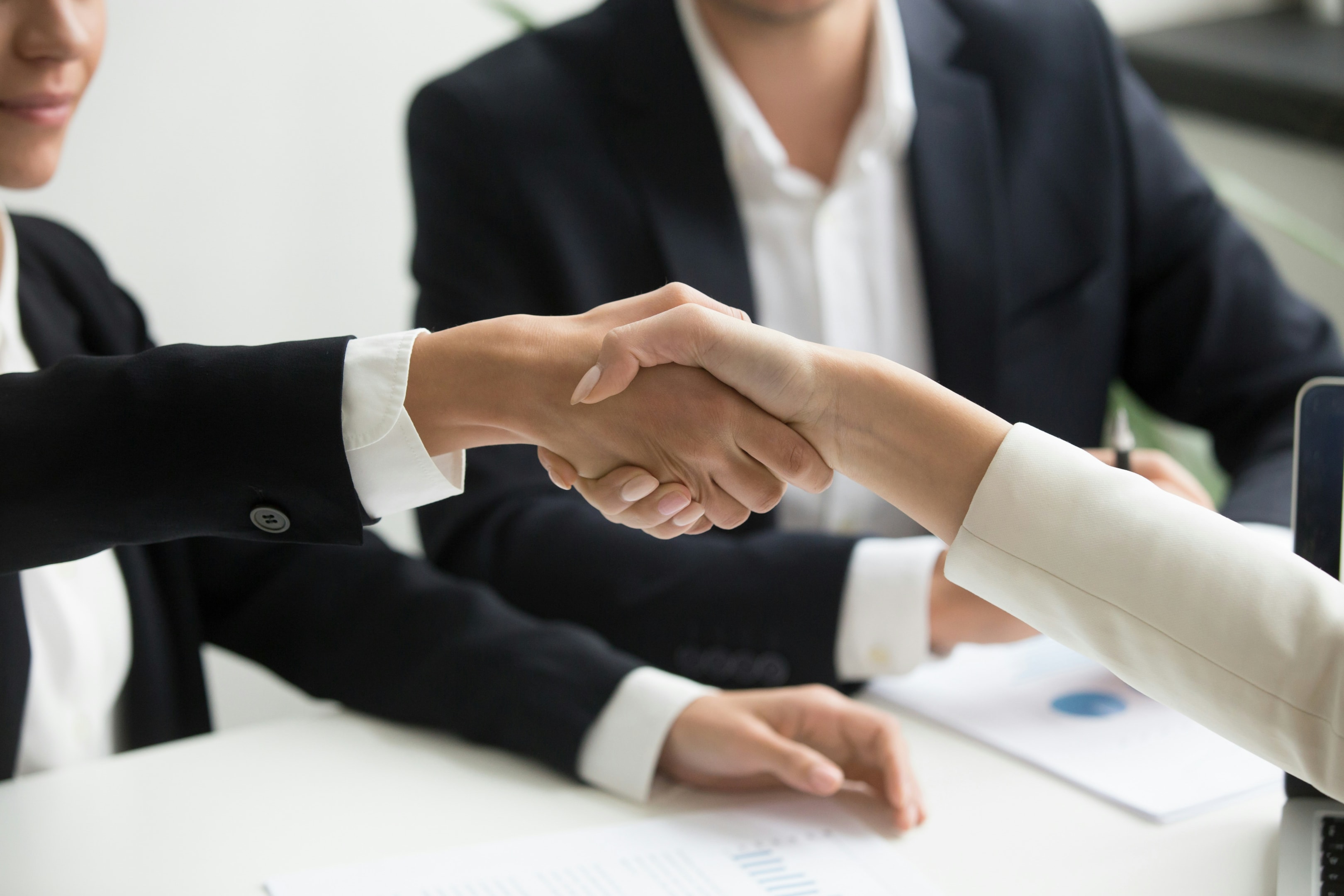 Handshake between real estate investor and seller of commercial property.