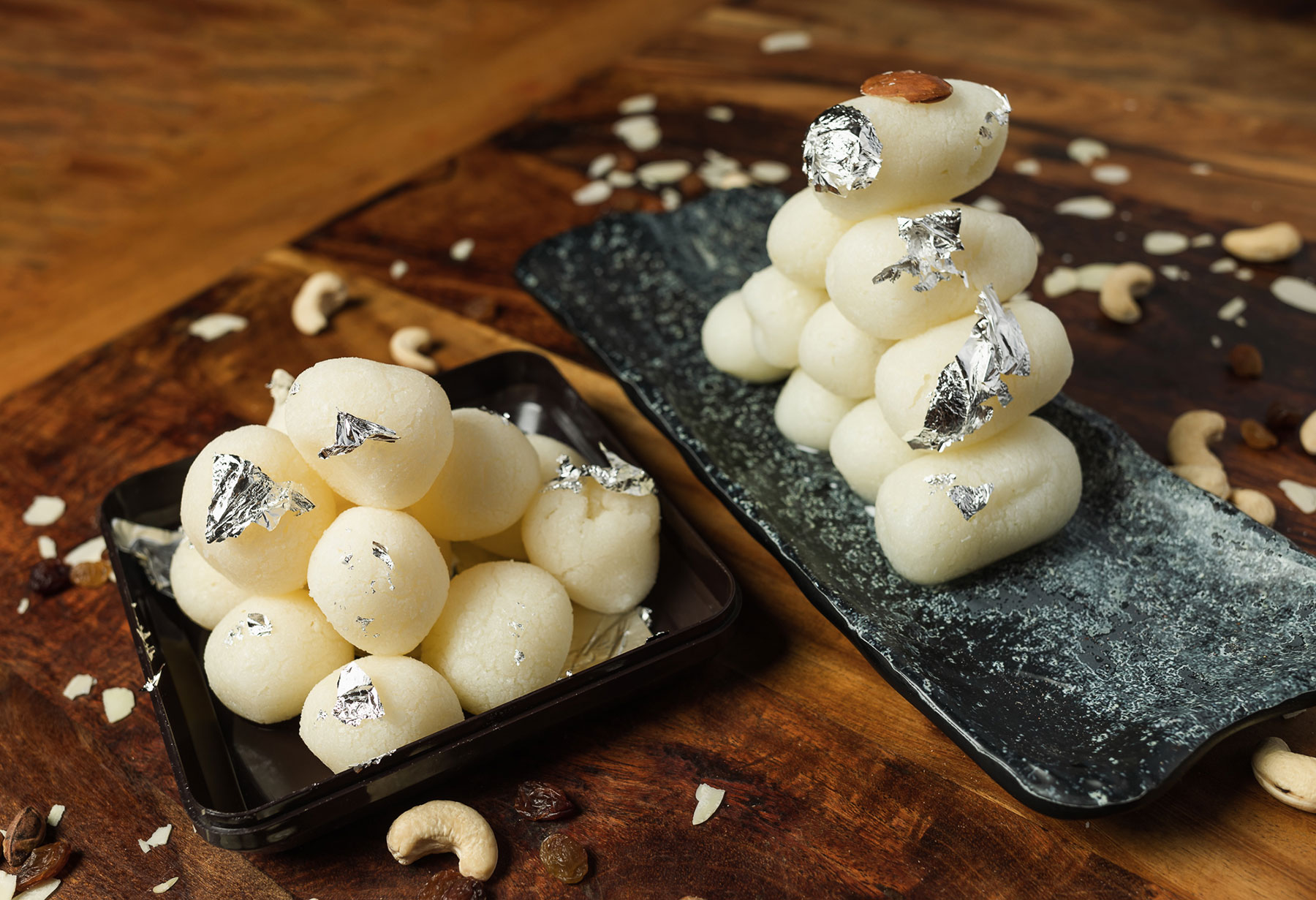 Delicious homemade rasgullas, a popular Indian sweet made from cottage cheese, in sugar syrup.