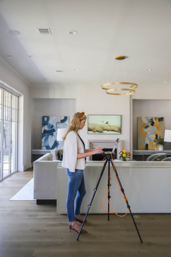  senior designer takes photos during an installation