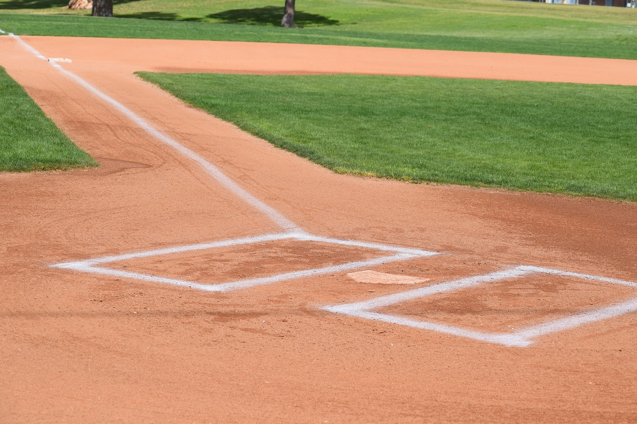 An image showing step-by-step instructions on how to chalk a baseball batter's box during the process of prepping the baseball field.