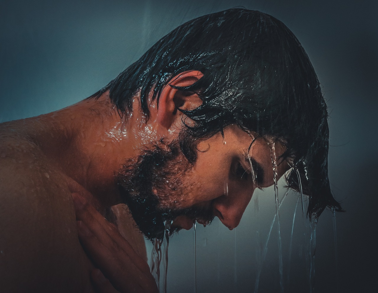 a man taking a shower to sober up from weed