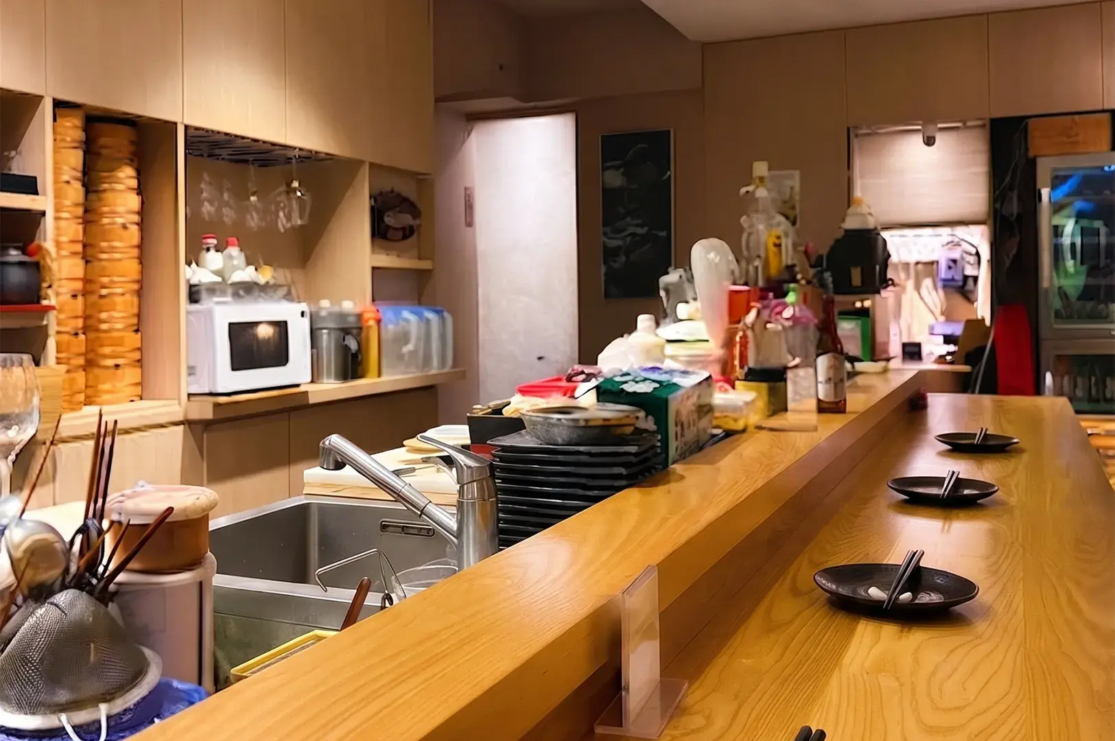Sushi counter and wooden interior at Bistro Du Le Pin.