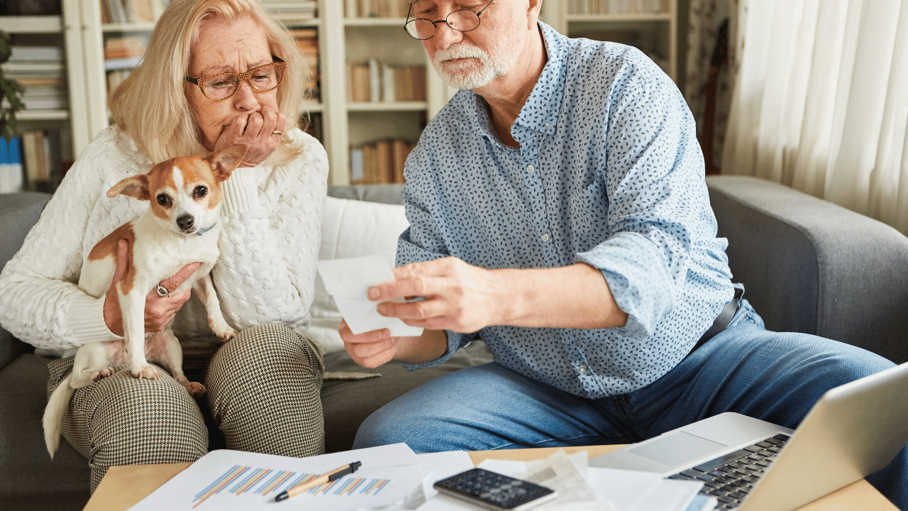 A senior couple discussing cost considerations when hiring an elder law attorney