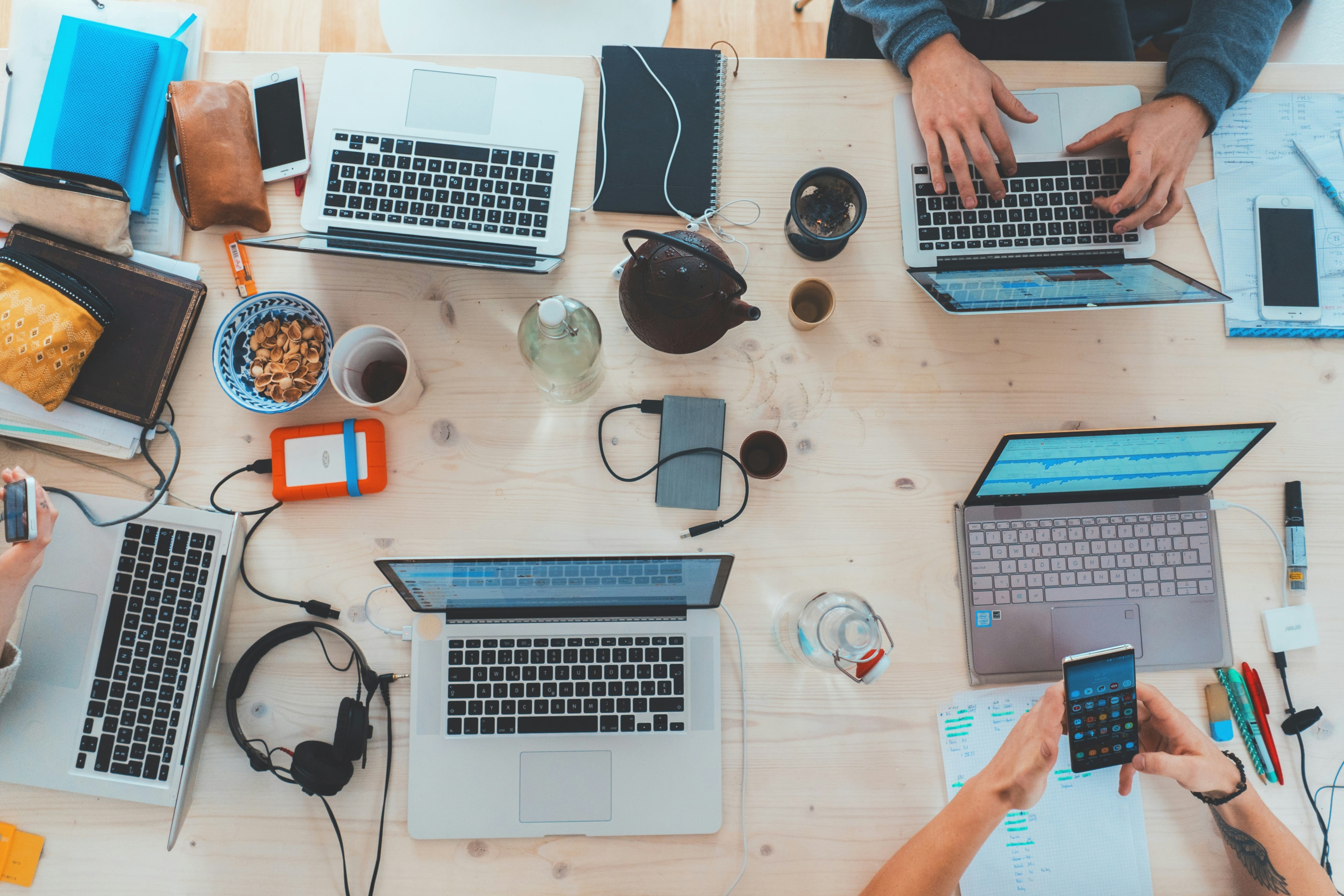 Team of real estate professionals looks into various digital marketing techniques.