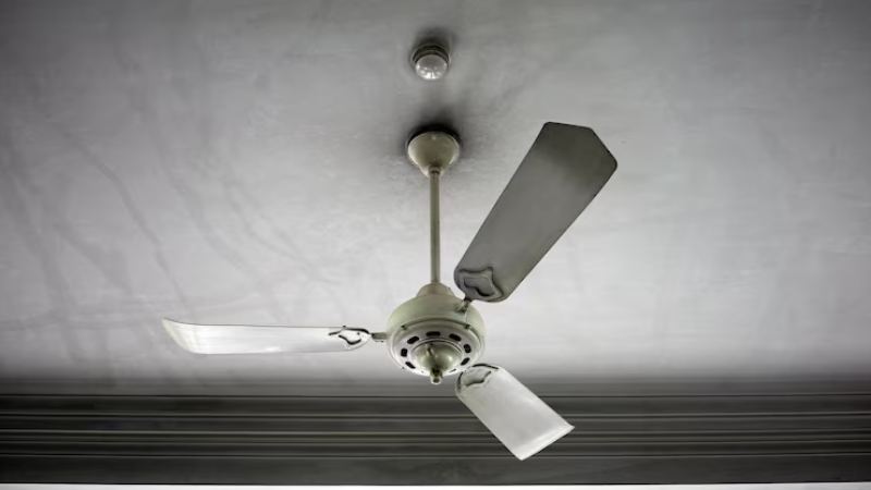 Gray color fan belnding with ceiling color offering an aesthetic look to room