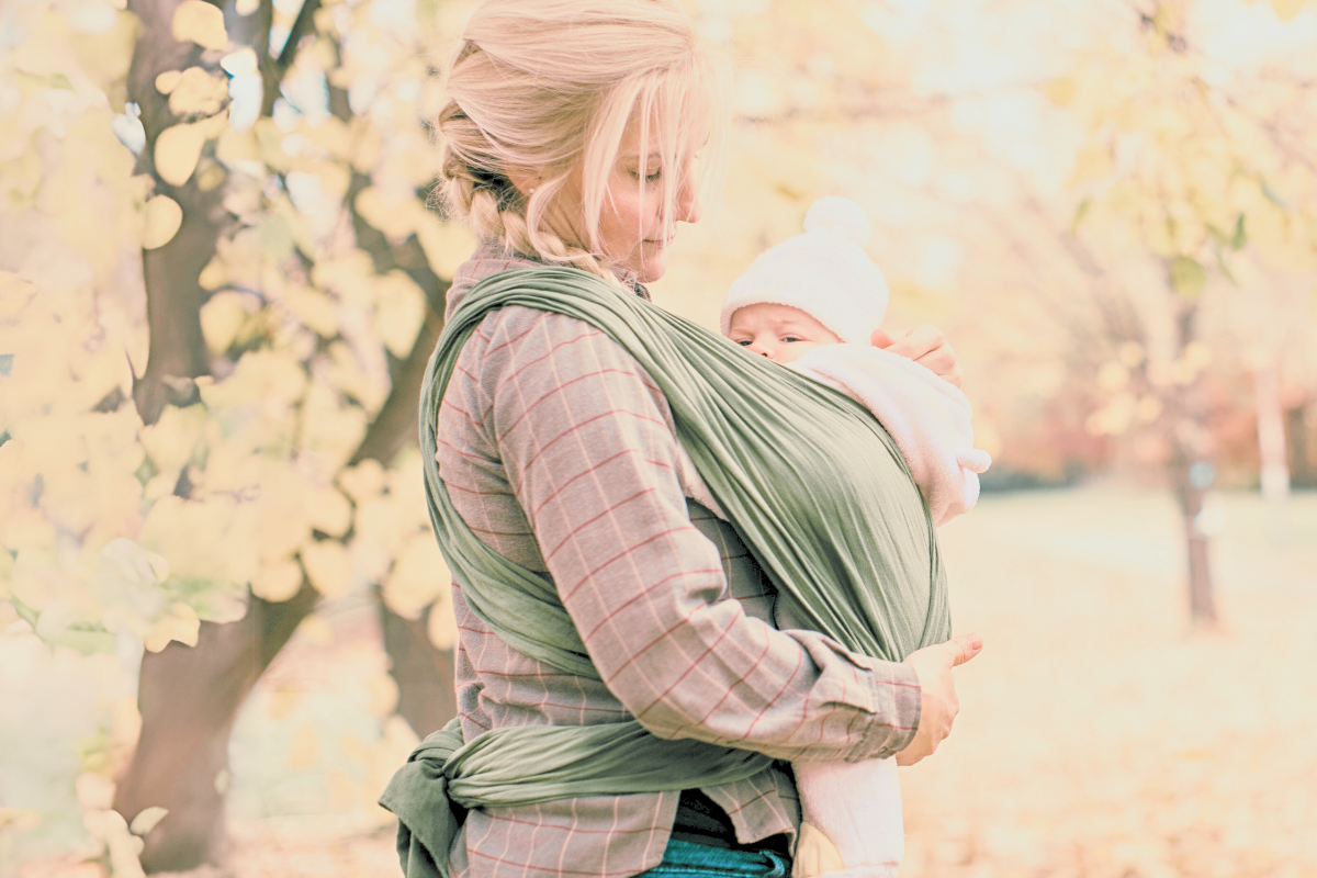 mom wearing newborn