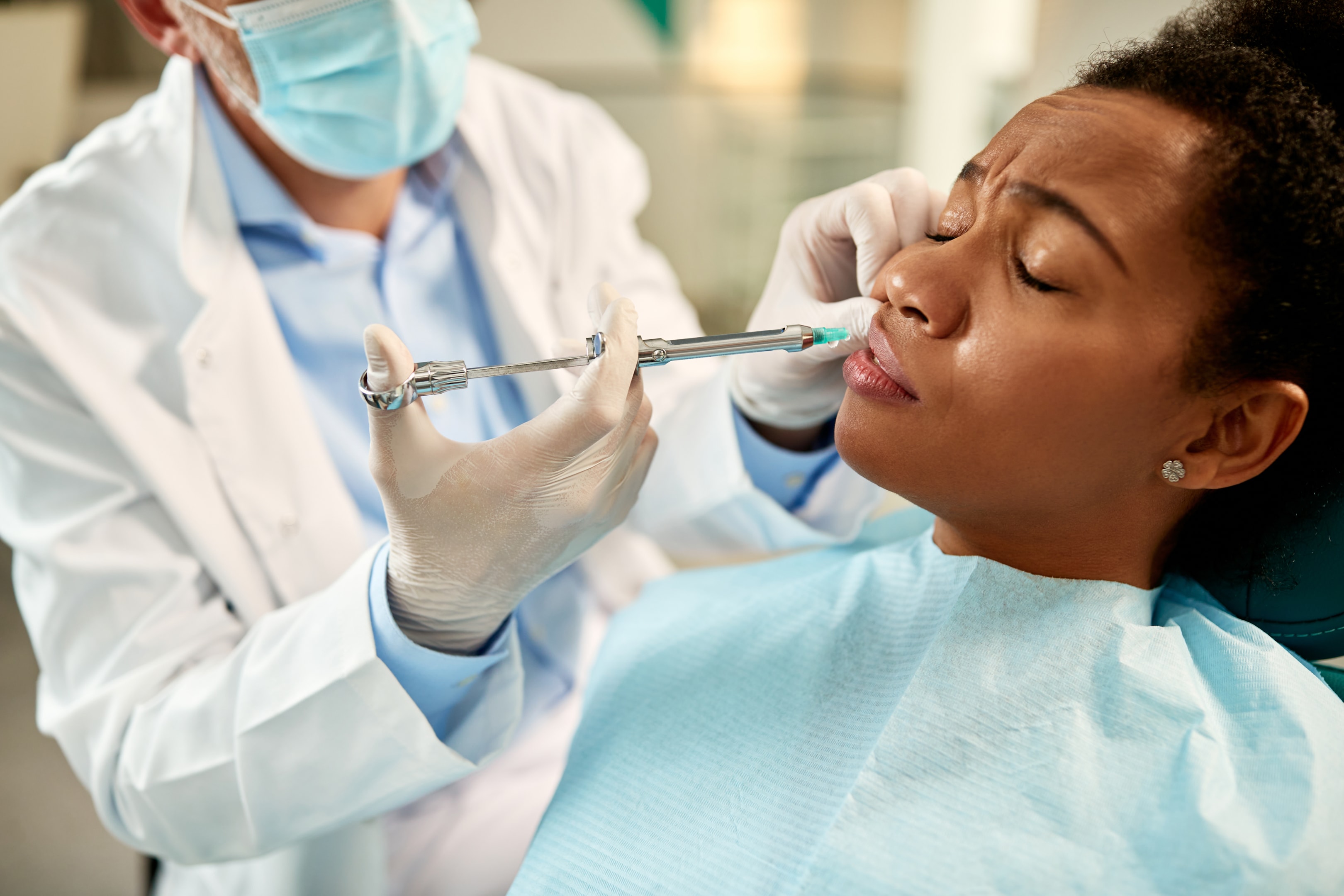 An image of a woman during wisdom teeth removal surgery.