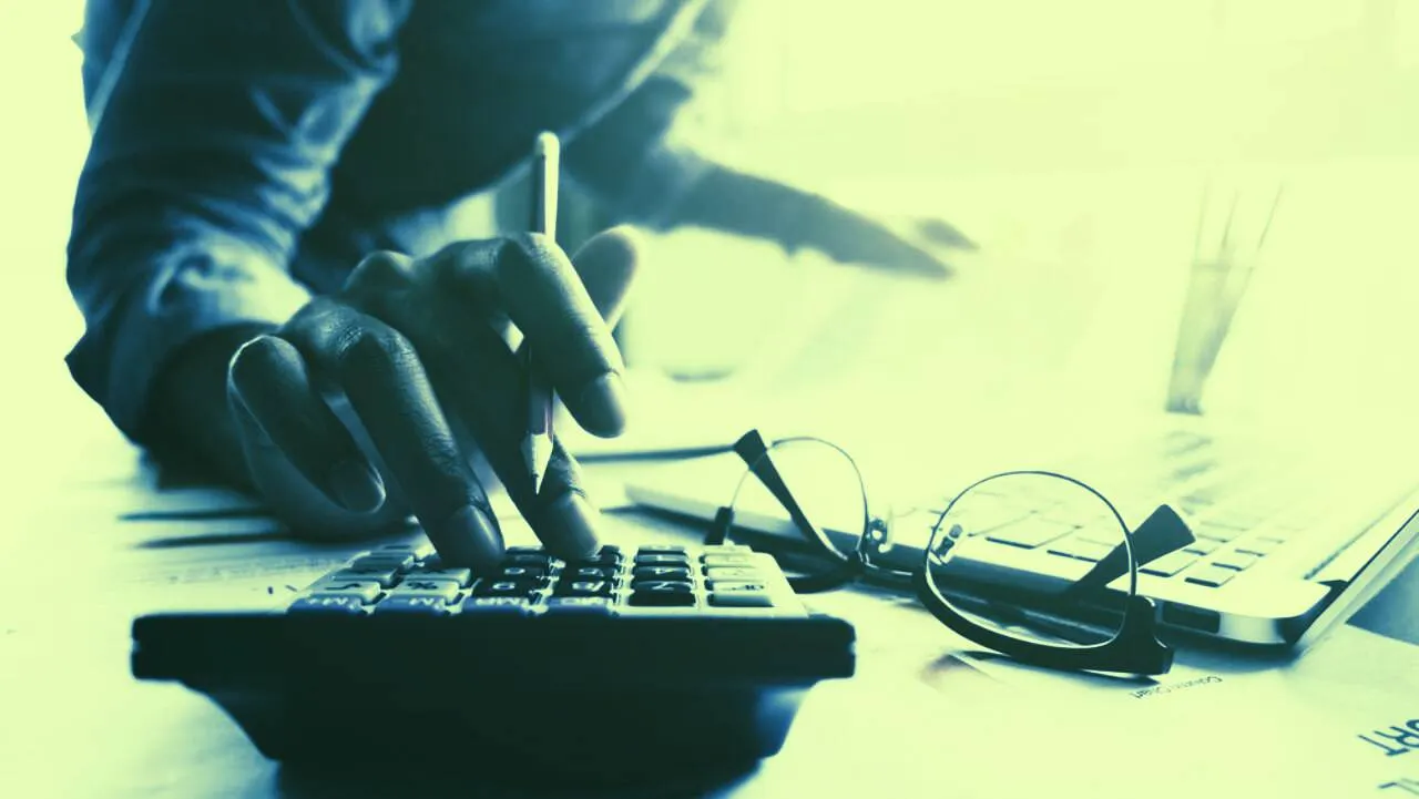 A person making a charitable donation using cryptocurrency, illustrating the concept of charitable donations of crypto.