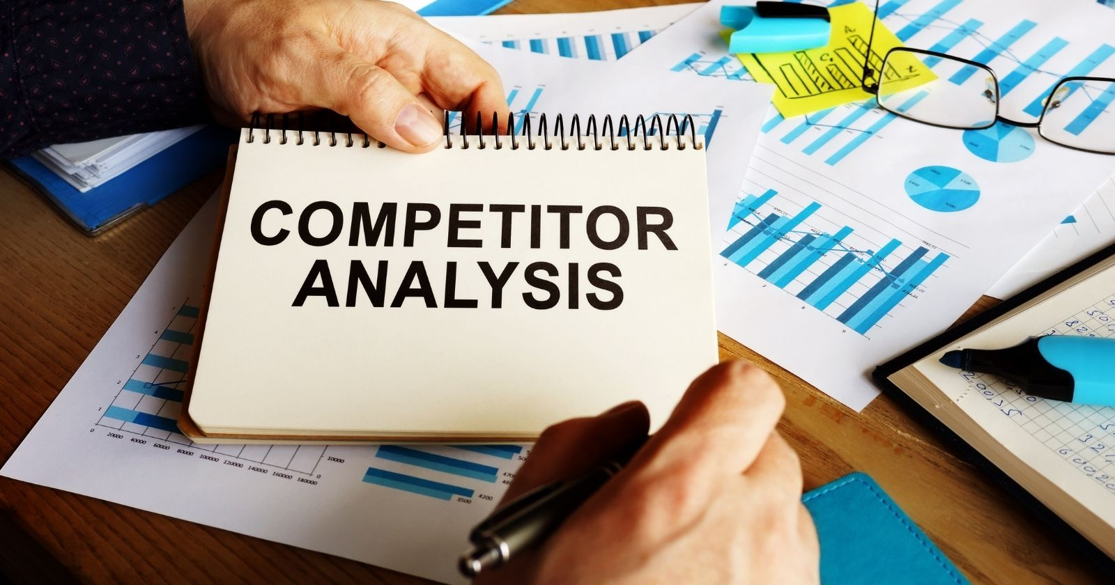 Notepad with a text "Competitor Analysis"