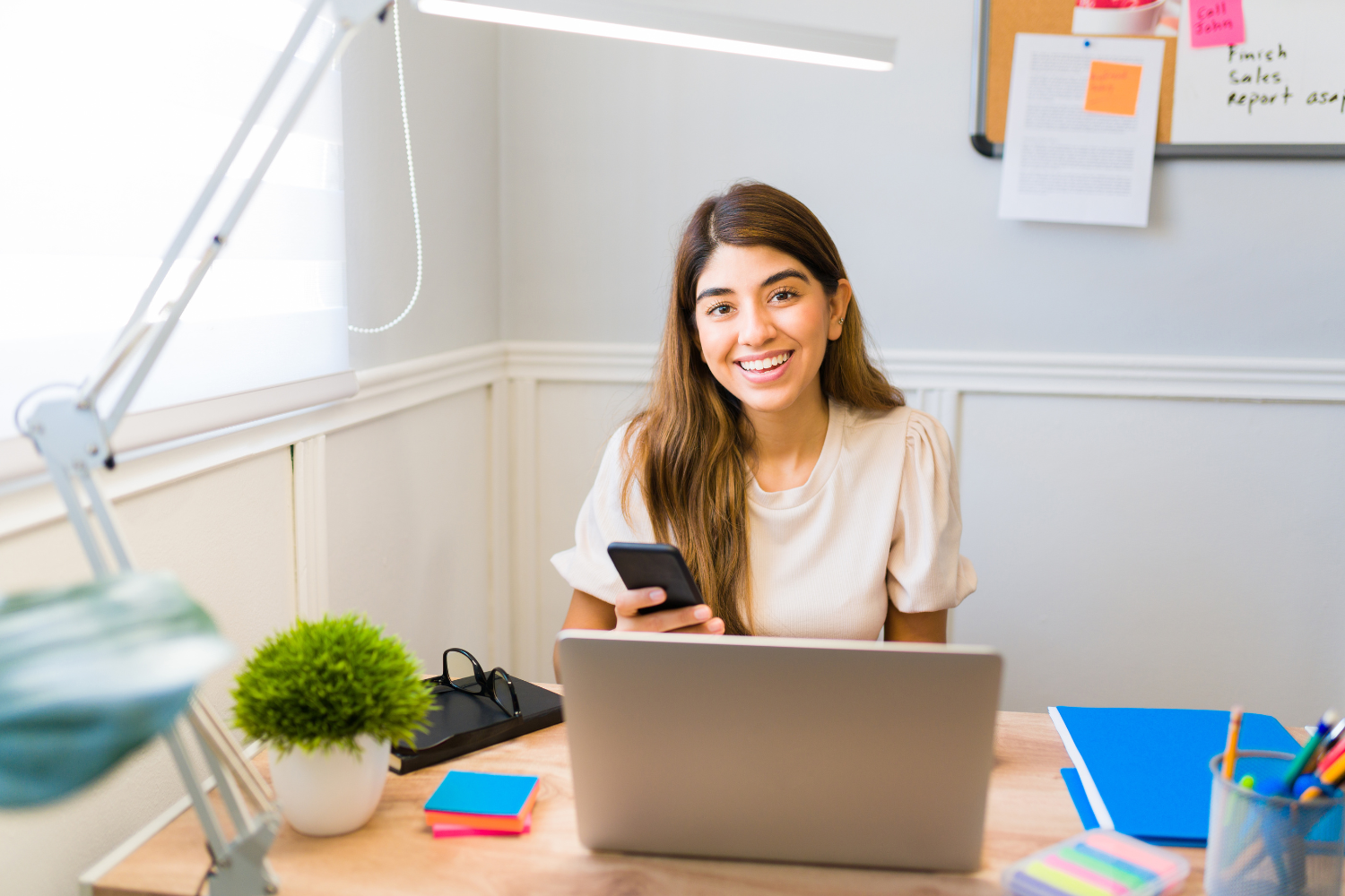 A happy virtual worker in her desk.