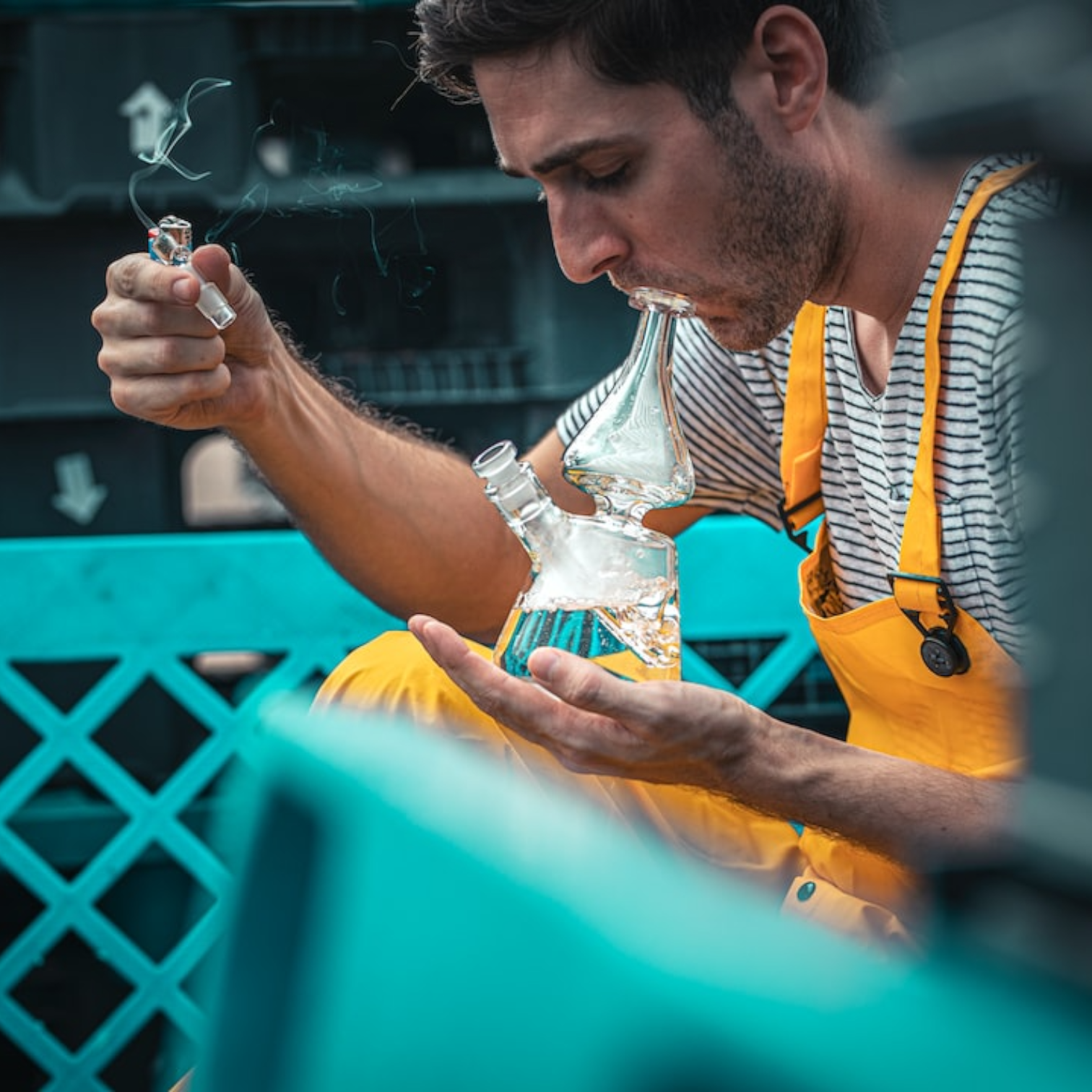 a man smoking from a bong