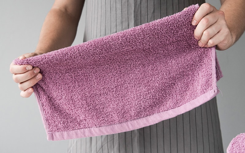 Women folding a towel