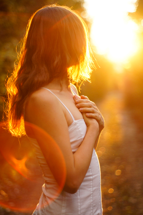 Woman getting ready to send love to a recipient.