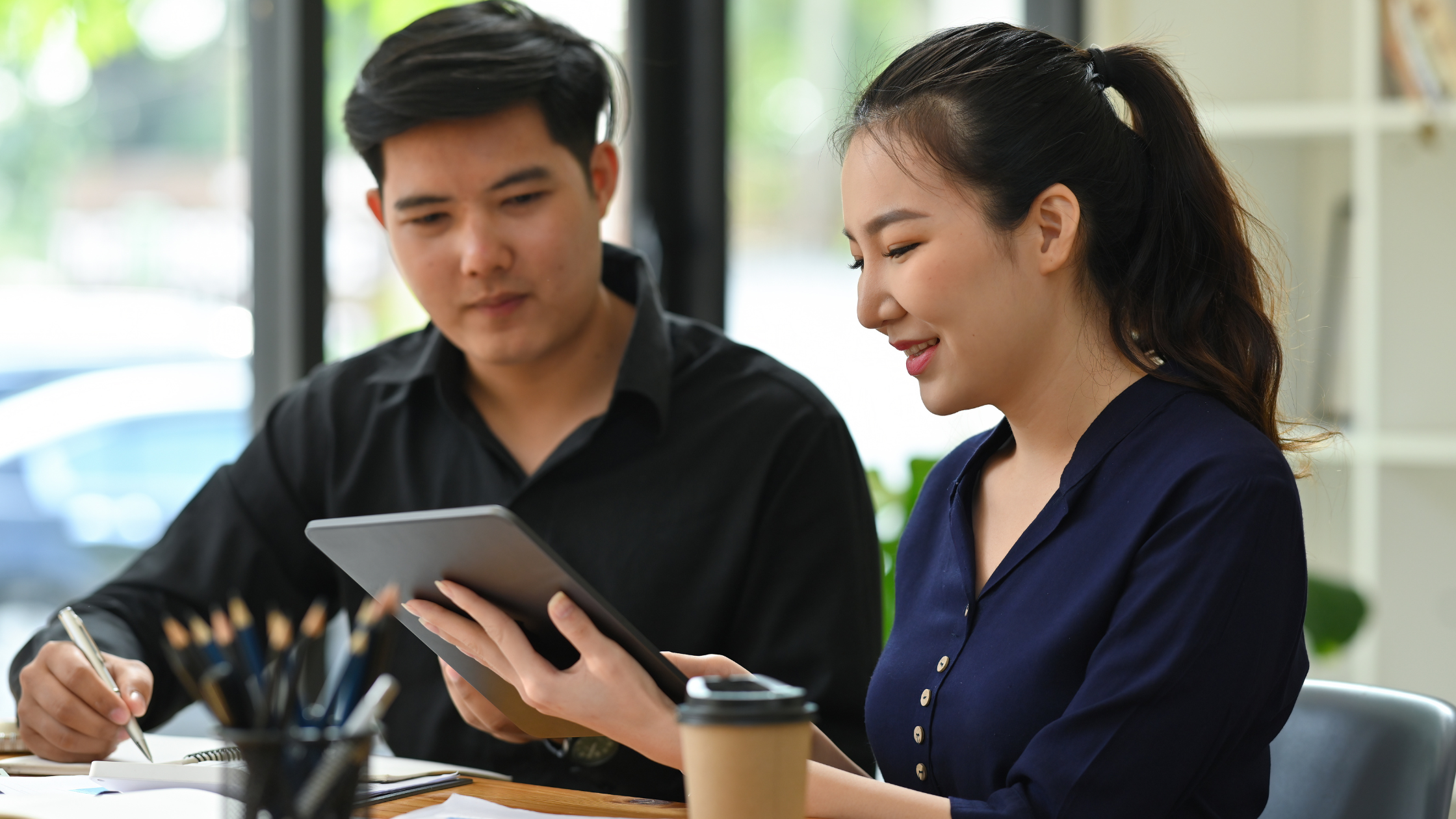 A small business owner reviewing their UCaaS provider options with a Ten4 representative.